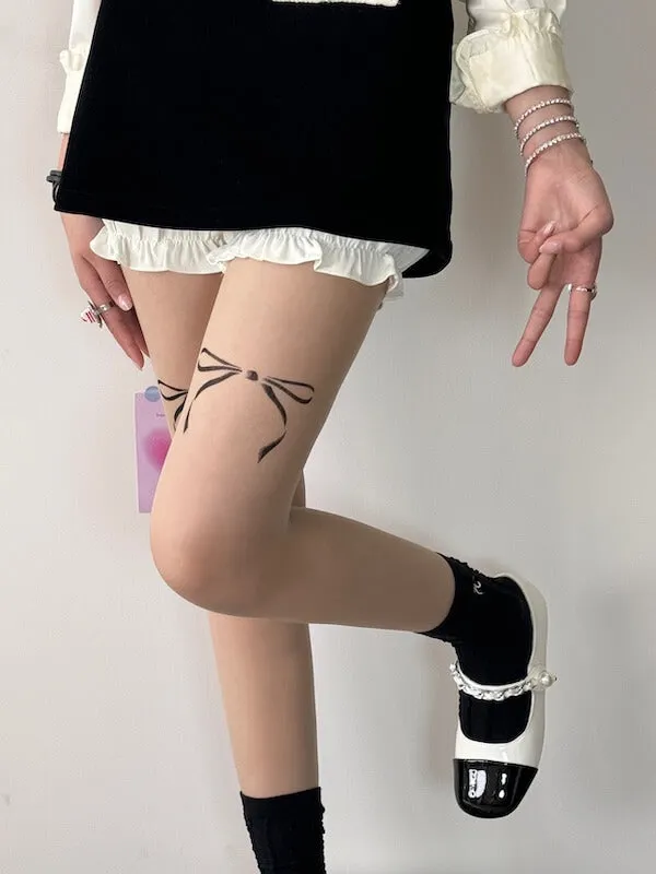 Dollette bow tattoo tights