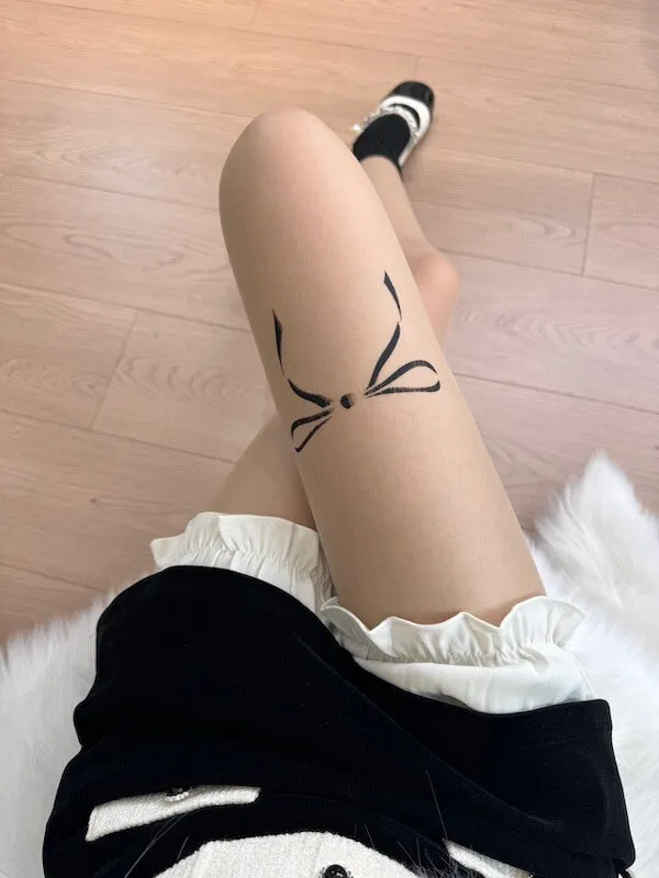 Dollette bow tattoo tights