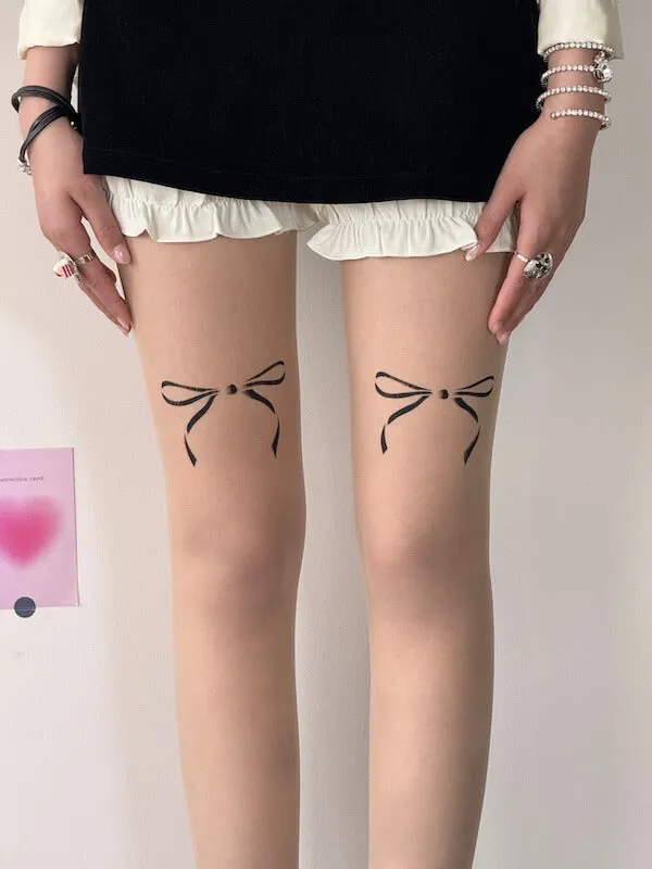 Dollette bow tattoo tights