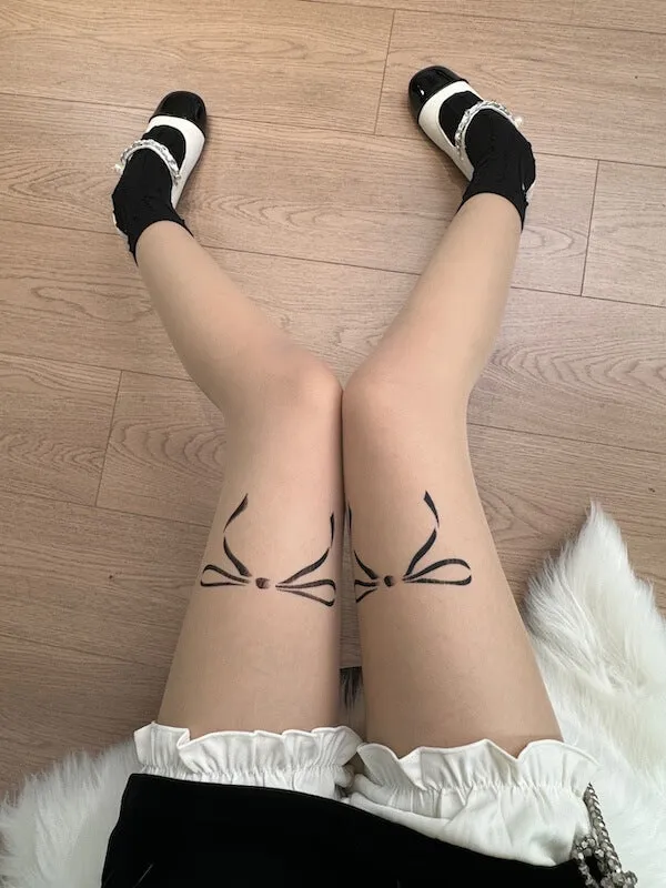 Dollette bow tattoo tights