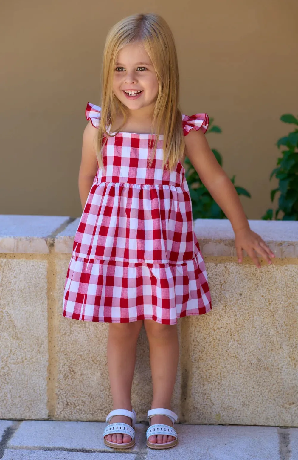 Girls dress with red and white checks. Rapife